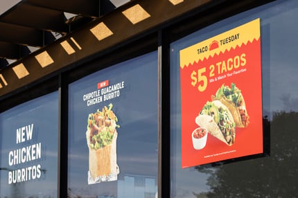 sign promoting deal at local restaurant
