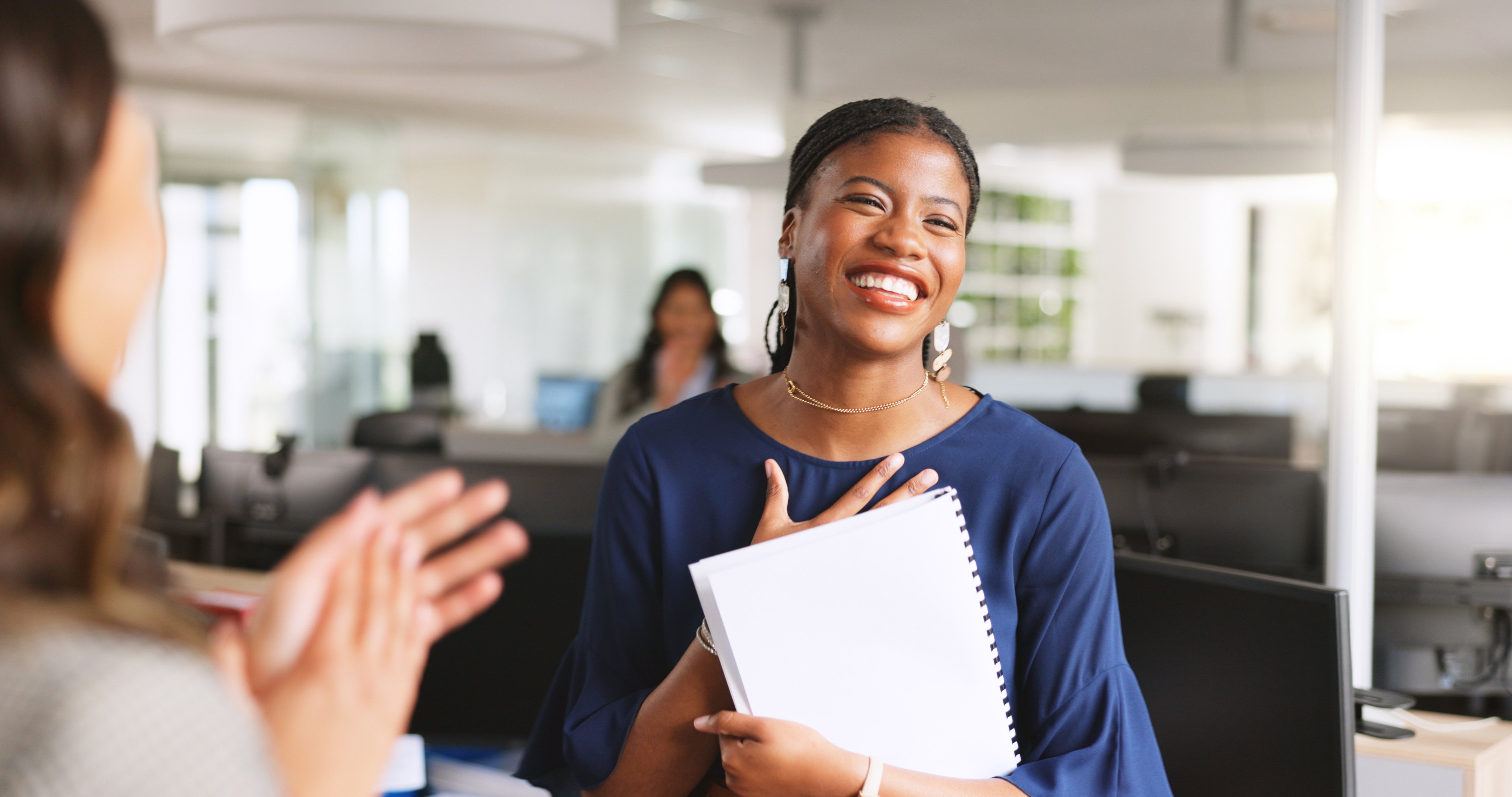 woman being recognized at work