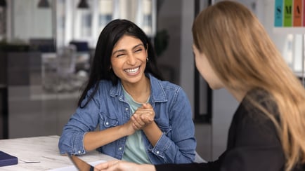 Happy coworkers discussing