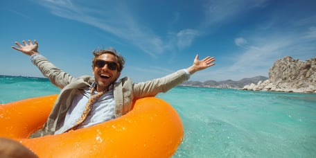 employee floating on water on vacation