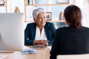 Manager happily meeting with employee